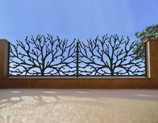 Black powder coated laser cut metal fence panels featuring organic tree branch pattern with scalloped top profile installed on low wall
