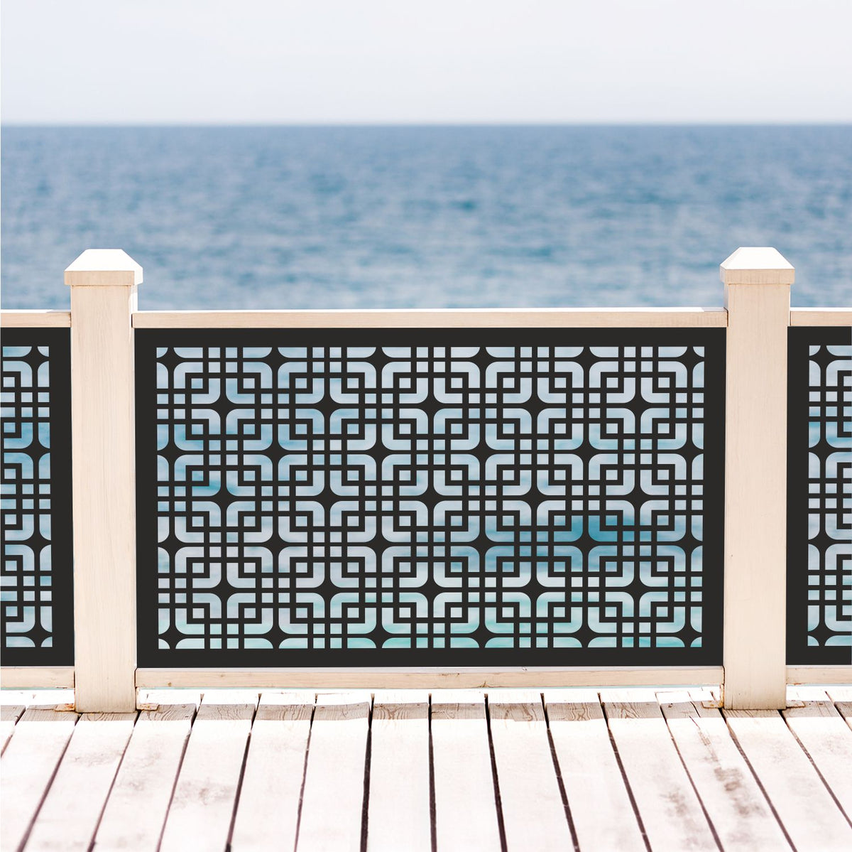 Black decorative laser cut metal deck railing insert panel with modern mid-century geometric interlocking pattern