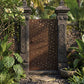 Minimalist laser cut steel gate panel detail with daisy pattern and powder coated brown finish