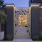 Deep Sea Coral decorative metal side gate close-up showing flowing laser cut tree branches
