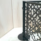 Two laser cut dog pool fence panels joined at an adjustable corner angle on a single freestanding round base post