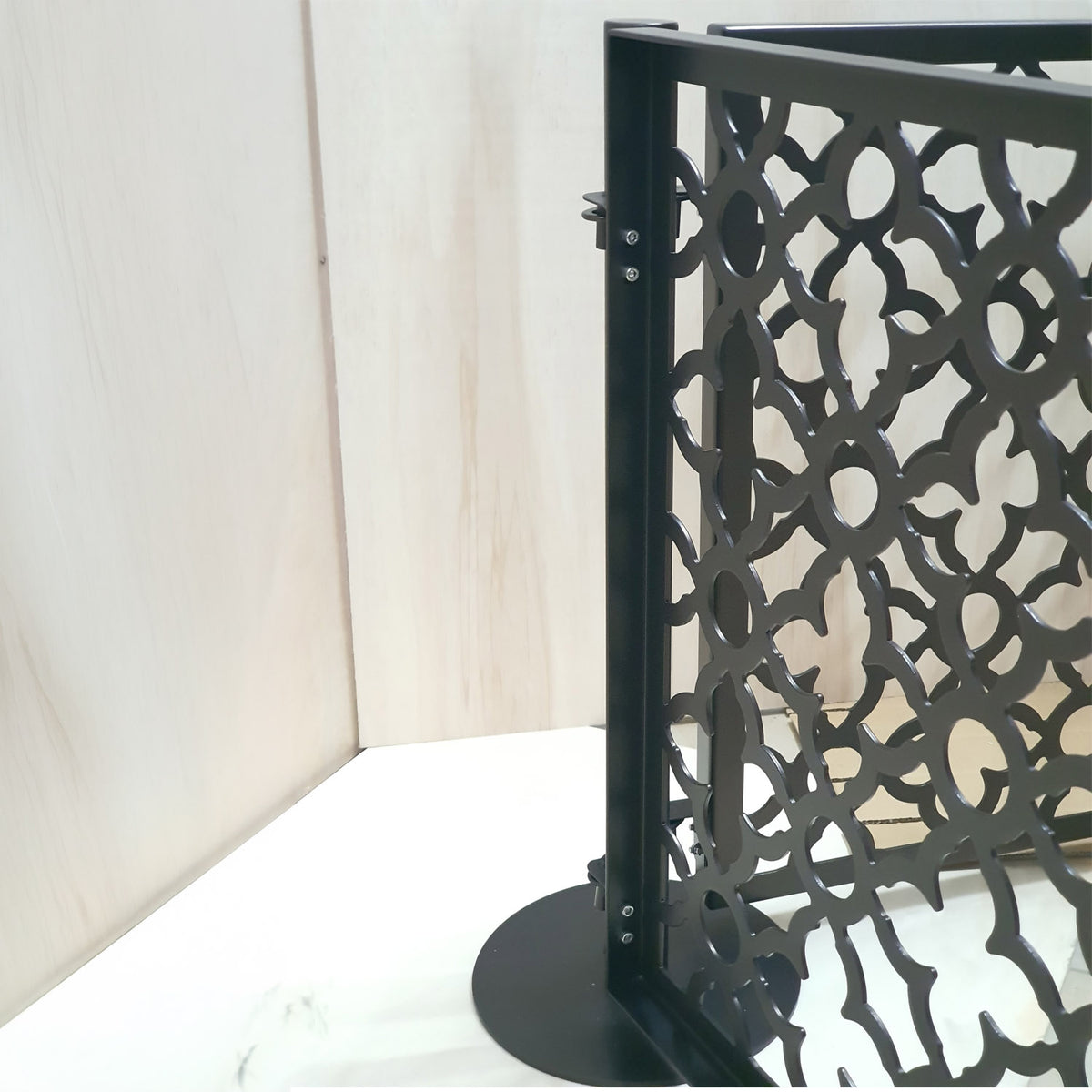 Two laser cut dog pool fence panels joined at an adjustable corner angle on a single freestanding round base post