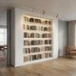 Modern white built-in bookcase featuring LED backlit shelves with brass gallery rail brass rods holding books in a luxury living room.