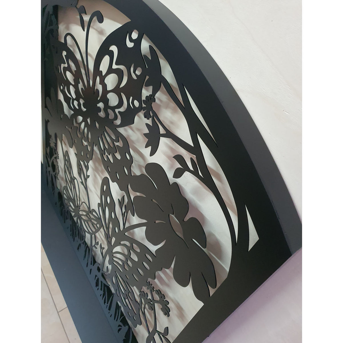 Metal laser cut pedestrian garden gate featuring curved arched top frame with butterflies and botanical wildflower pattern
