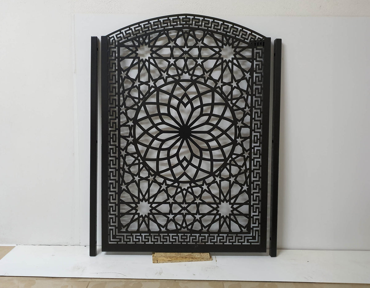 Black powder coated laser cut metal pedestrian garden gate featuring arched top frame with Islamic geometric star pattern and Greek key border