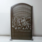 Brown powder coated laser cut metal pedestrian garden gate with arched top frame featuring central daisy flower garden pattern and vertical slatted bars