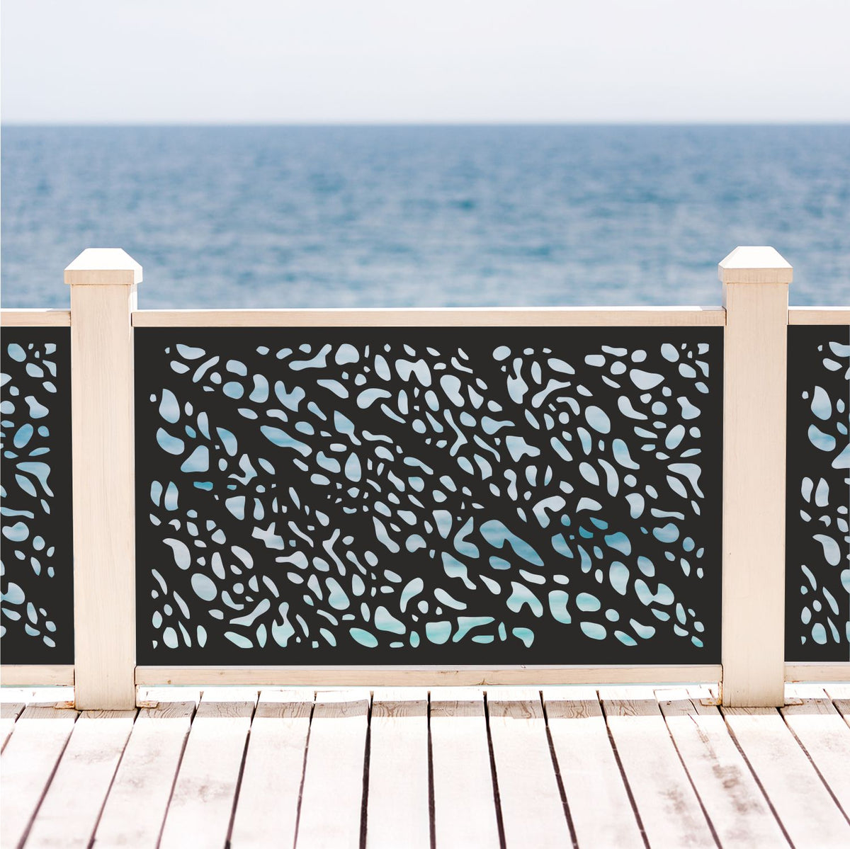 Black decorative laser cut metal deck railing insert panel with modern leopard animal print pebble pattern