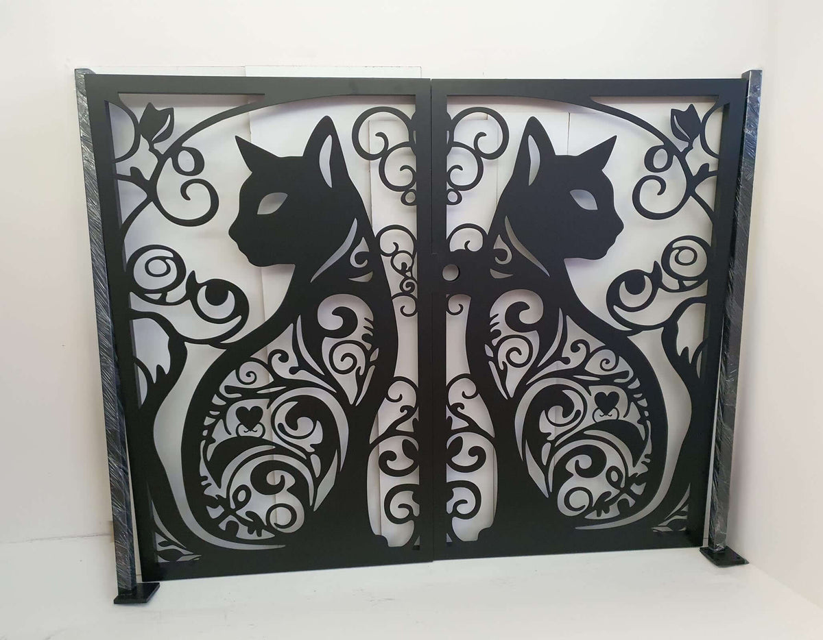Matte black powder coated laser cut metal double garden gate featuring ornate cat silhouette pattern installed between brick pillars