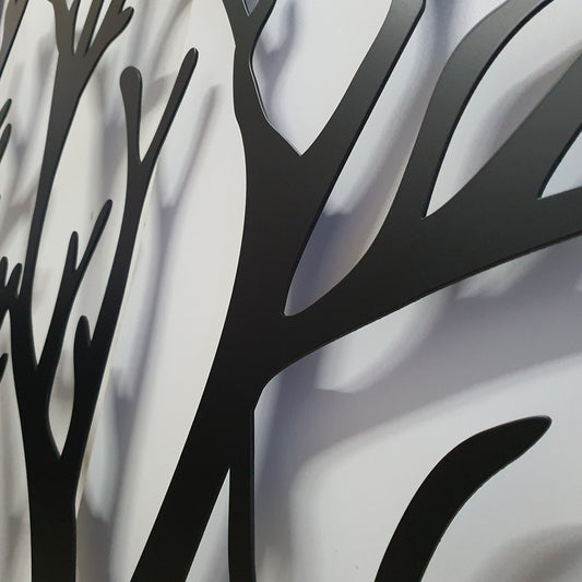 Perspective close-up detail of matte black powder coated laser cut metal gate featuring organic tree branch pattern