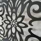 Black powder coated laser cut metal  pedestrian gate featuring arched top frame with ornate floral damask