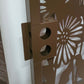 Brown powder coated laser cut metal pedestrian garden gate lock detail