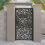 Black metal laser cut pedestrian garden gate featuring full coverage tropical lily flower and leaf mosaic pattern