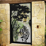 Black metal laser cut pedestrian garden gate featuring tiger in jungle and pine trees silhouette design