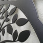 Matte black powder coated laser cut metal pedestrian garden gate featuring central circular tree of life pattern