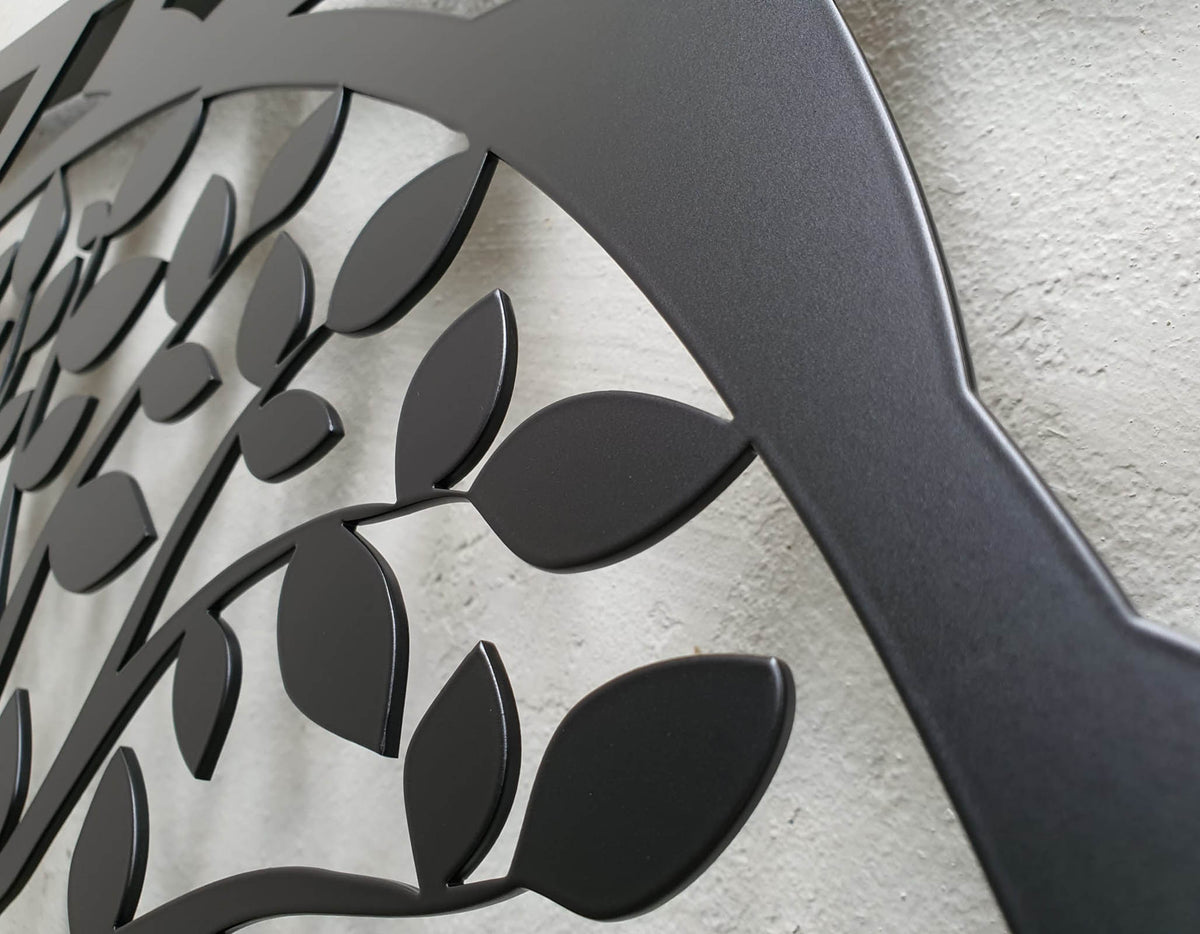 Matte black powder coated laser cut metal pedestrian garden gate featuring central circular tree of life pattern