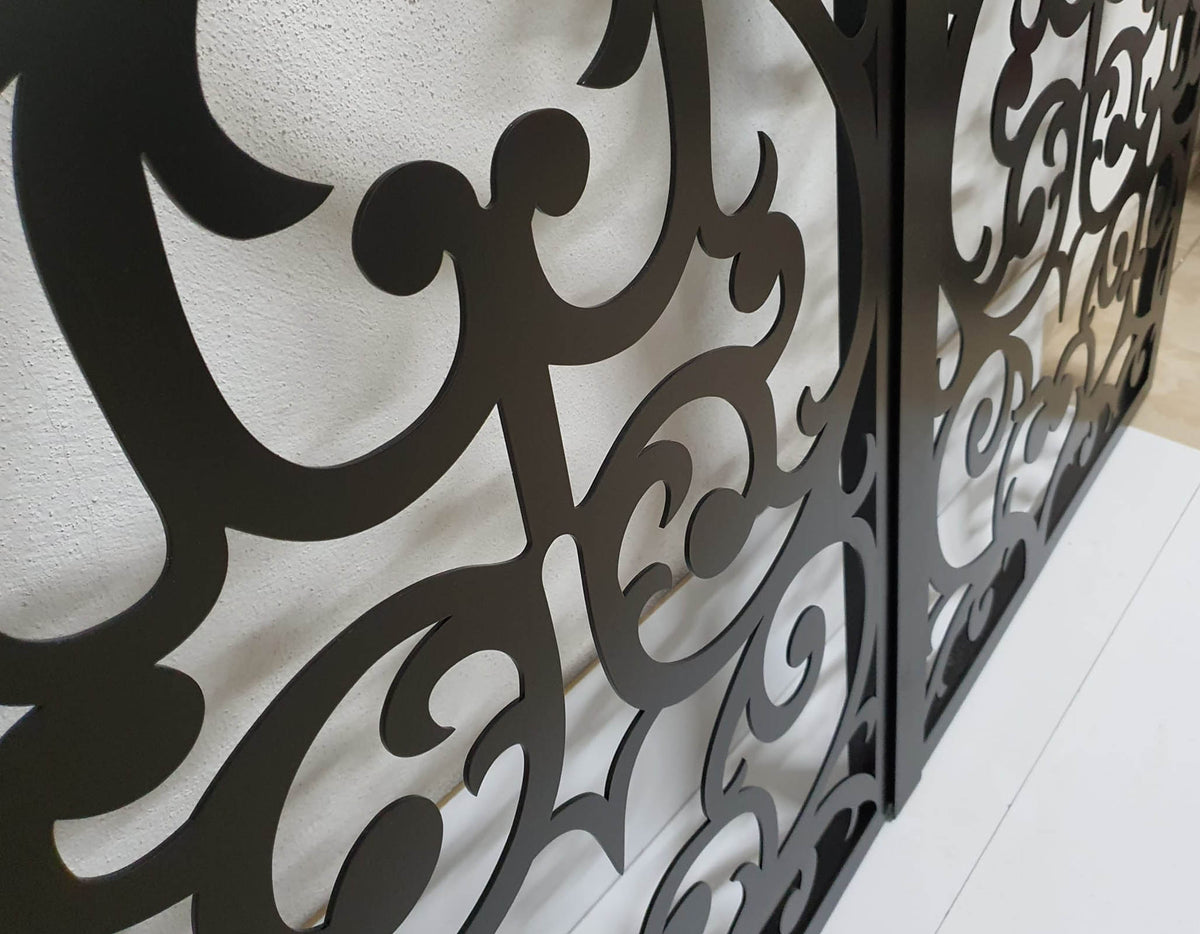 Black powder coated laser cut metal pedestrian garden gate featuring ornate scrollwork and circular medallion pattern
