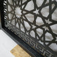 Laser cut metal pedestrian garden gate featuring arched top frame with Islamic geometric star pattern and Greek key border