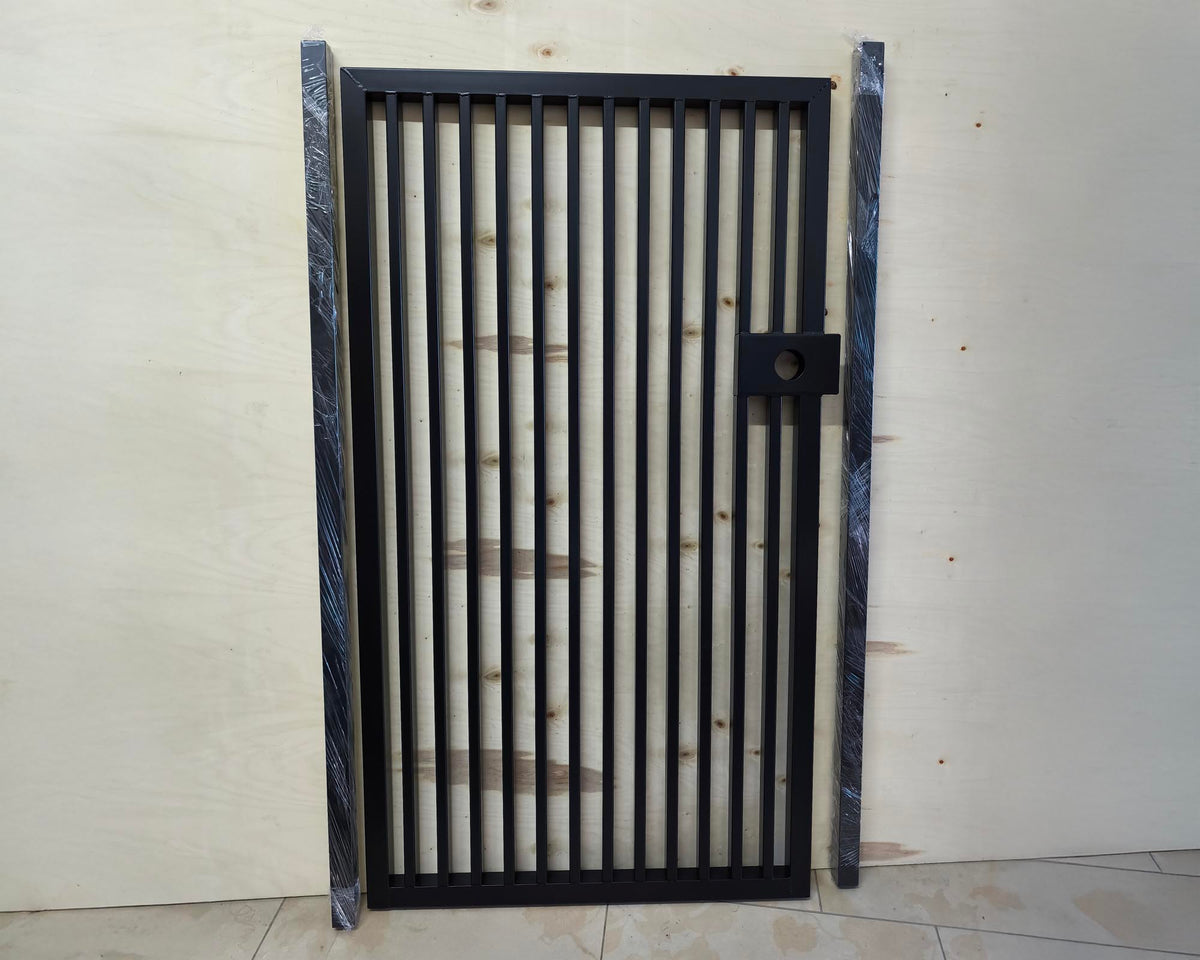 Black powder coated modern metal pedestrian garden gate featuring vertical slatted bar pattern and side mounting posts