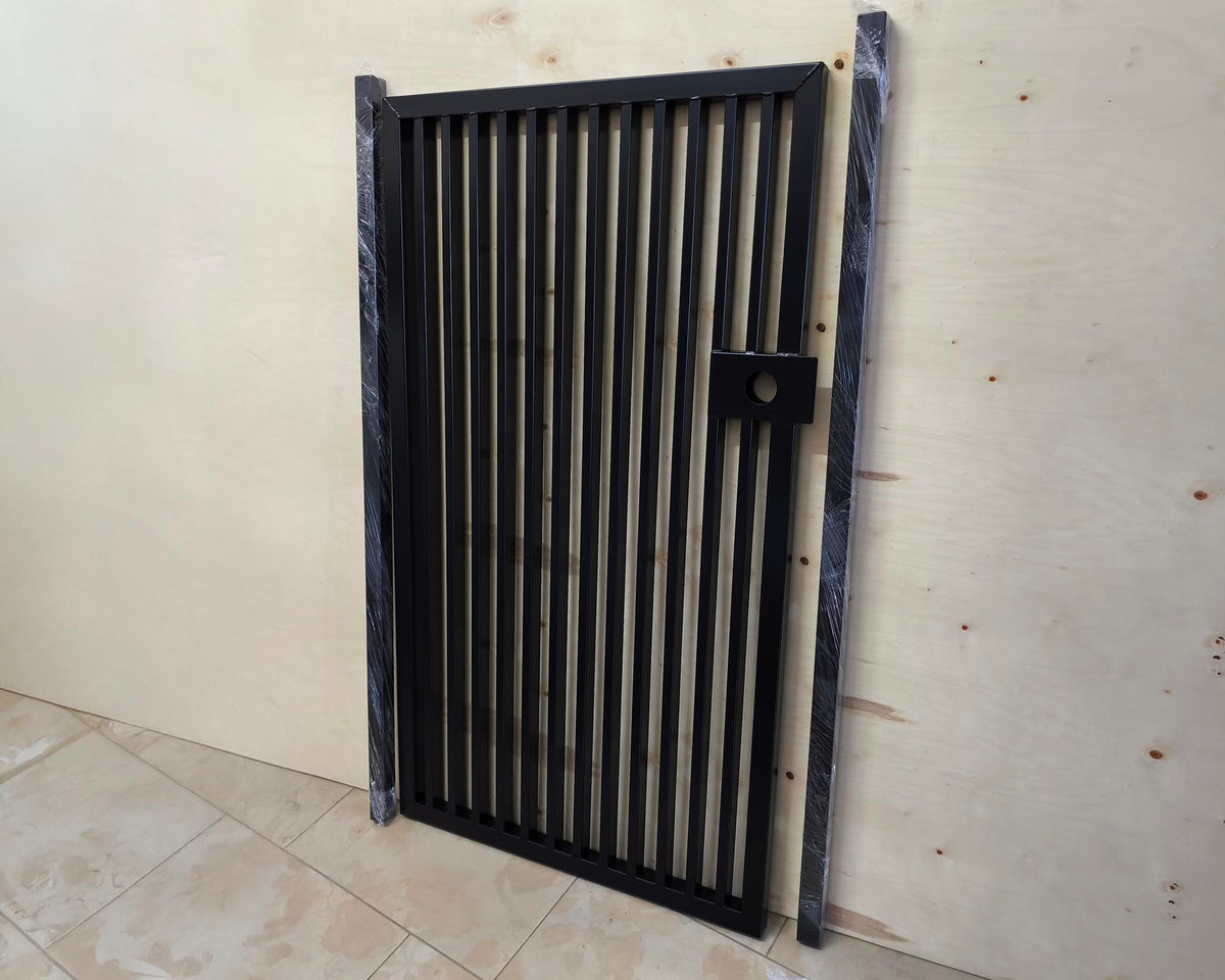 Matte black powder coated modern metal pedestrian garden gate featuring vertical slatted bar pattern and side mounting posts