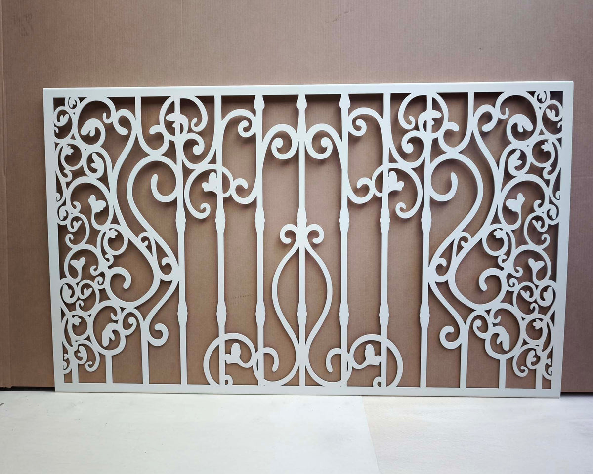 White powder coated laser cut metal fireplace screen panel featuring traditional wrought iron scrollwork and ornate bar pattern