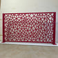 Honeycomb Voronoi laser cut metal railing panel in glossy red powder coat with two steel posts and base plates