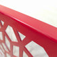Bent edge detail of a honeycomb Voronoi laser cut steel panel in glossy red powder coat