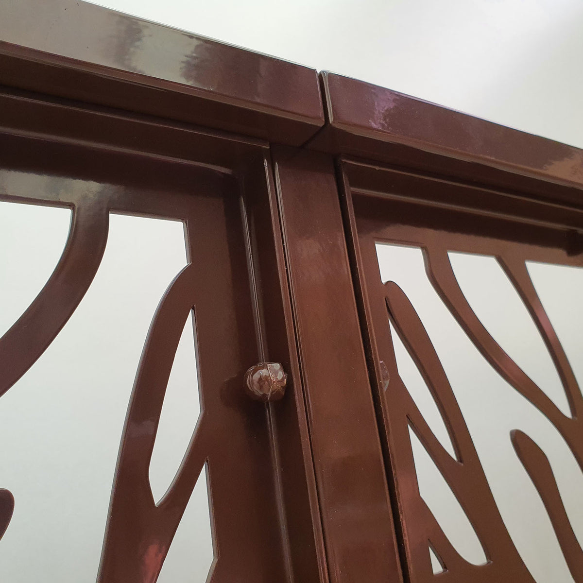 Dark brown metal laser cut deck railing panel featuring organic tree branch and coral silhouette pattern