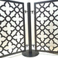 Close up front view of two laser cut quatrefoil pattern pool fence panels connected to one round base post with upper and lower drop in pins