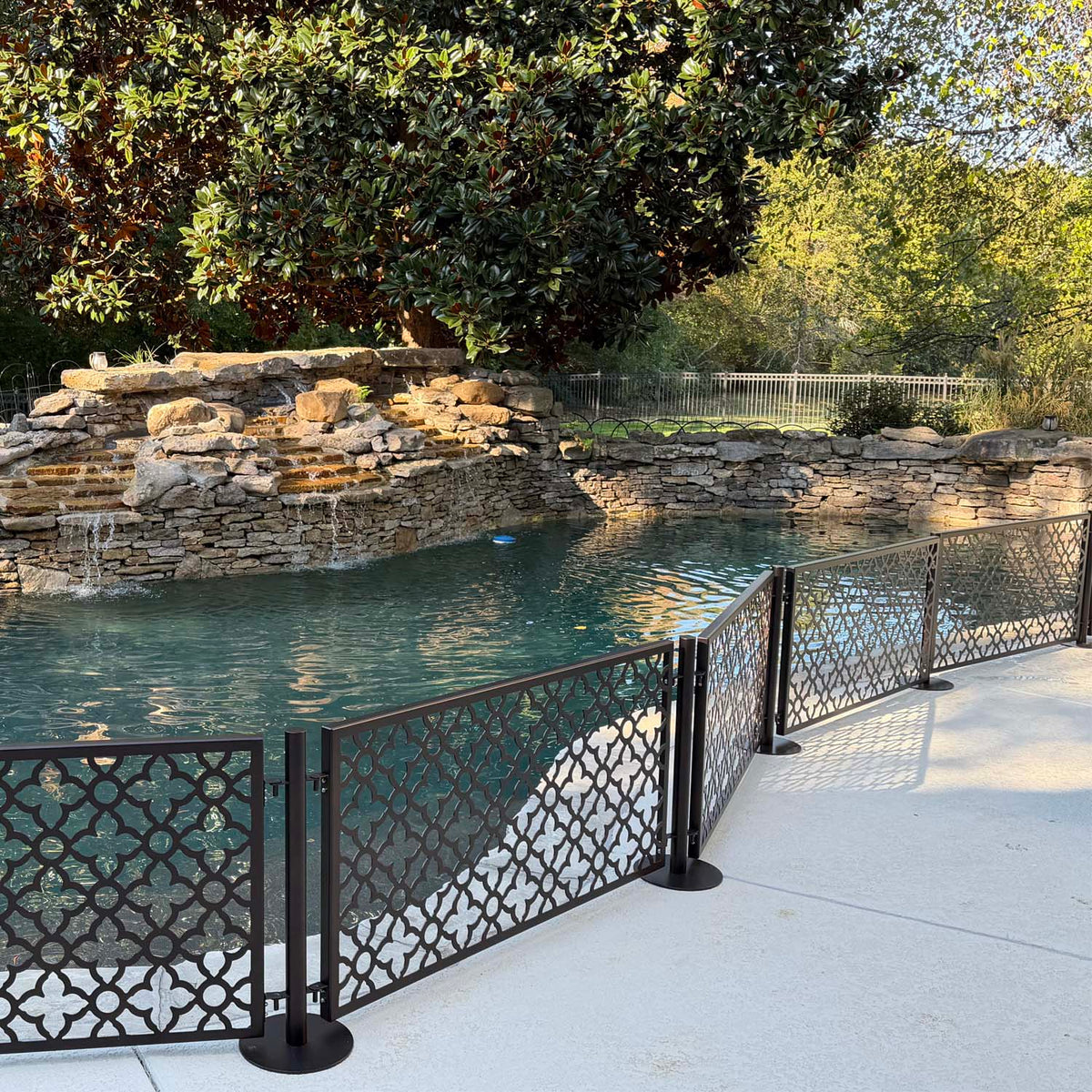 No drill dog pool fence with freestanding stainless steel post and laser cut panels
Tool free removable metal pool barrier for dogs on concrete pool deck
Moroccan pattern laser cut aluminum pool fence panel in bronze